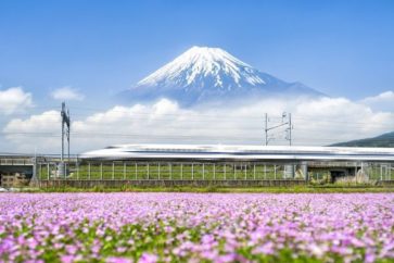 Tokaido Shinkansen bullet train passing by Mount Fuji, Yoshiwara, Shizuoka prefecture, Japan